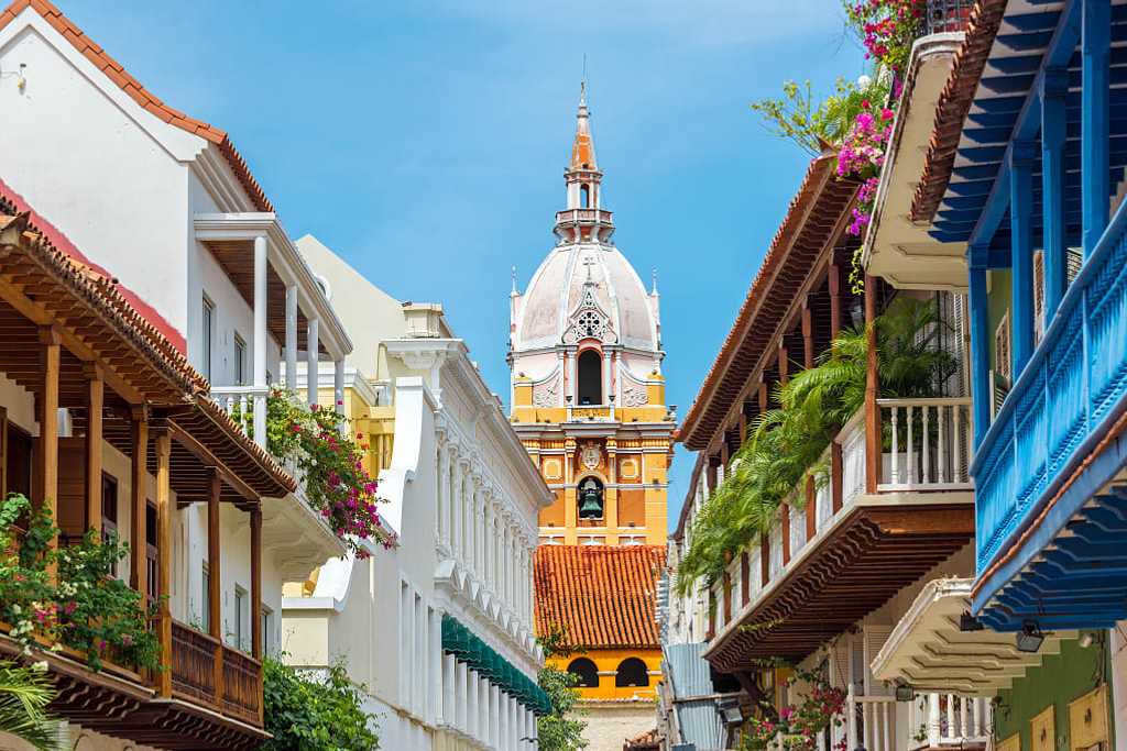 Balconies with flowers leading to cathedral in Cartagena, Colombia