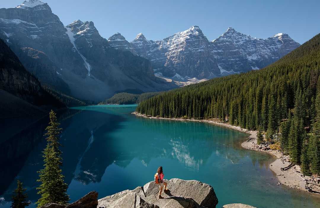 Woman hiking at Moraine Lake in Banff National Park, Canada