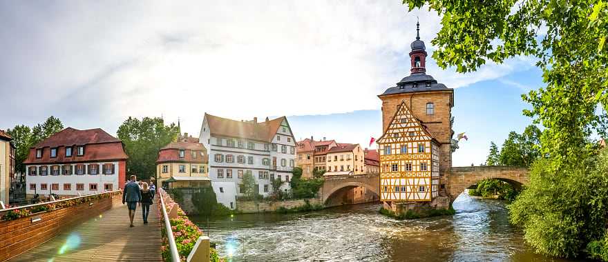 Couple walking across a bridge in Bamberg, Germany.