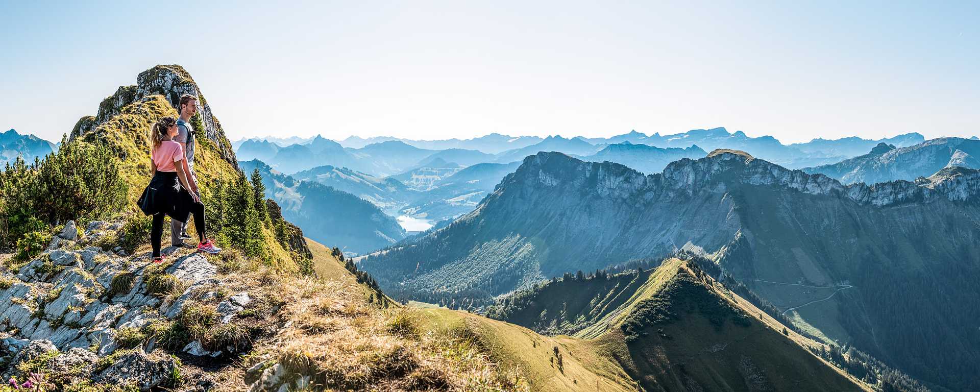 Couple hiking Rochers de Naye in Switzerland