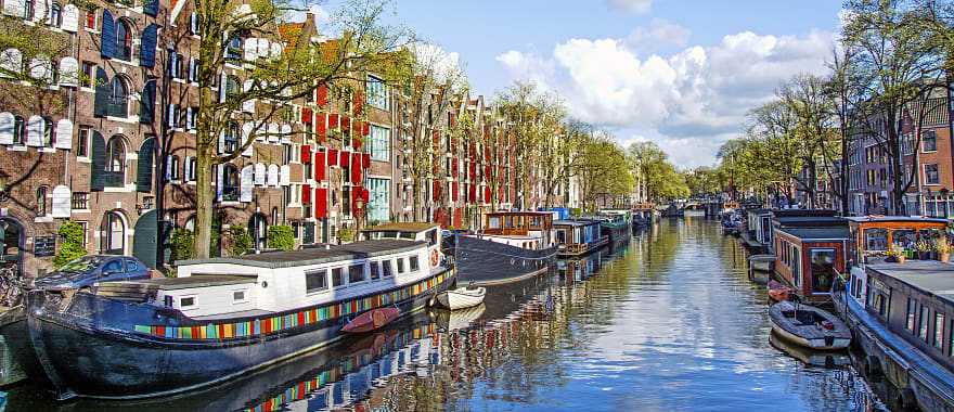 Dutch buildings and canal in Amsterdam, Netherlands