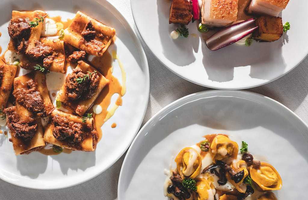 Three dishes of various Italian foods Three dishes of various Italian foods