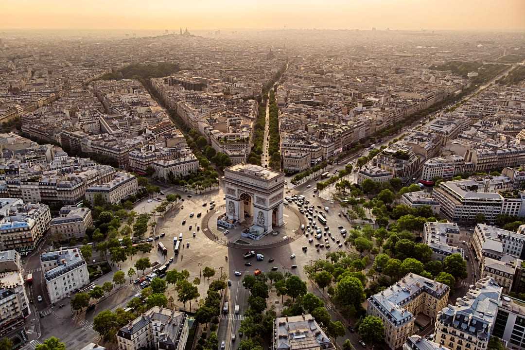 Arc de Triomphe at sunrise in Paris, France