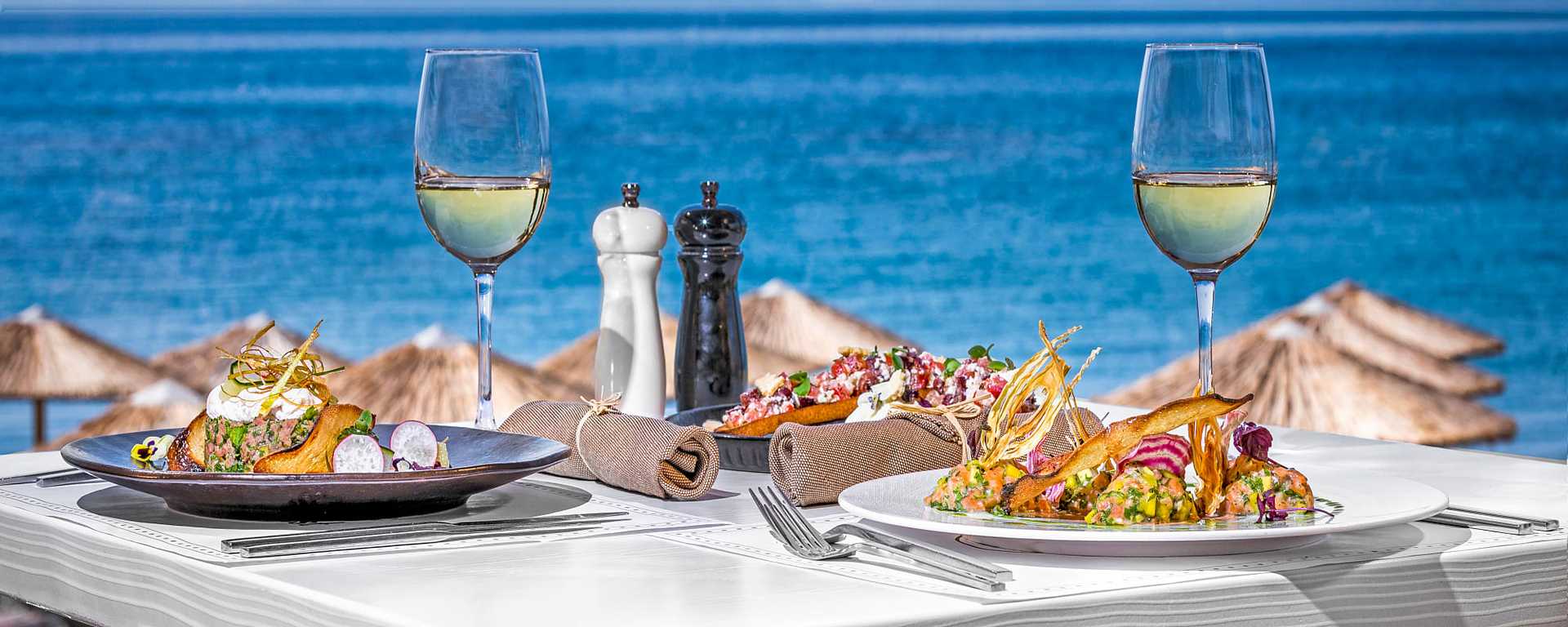 Beach side dining with Greek cuisine in Santorini