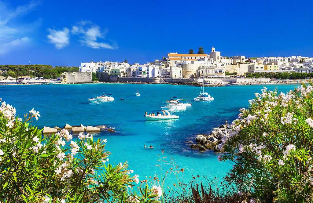 Boats in the crystal blue waters of Otranto in Puglia, Italy. Boats in the crystal blue waters of Otranto in Puglia, Italy.