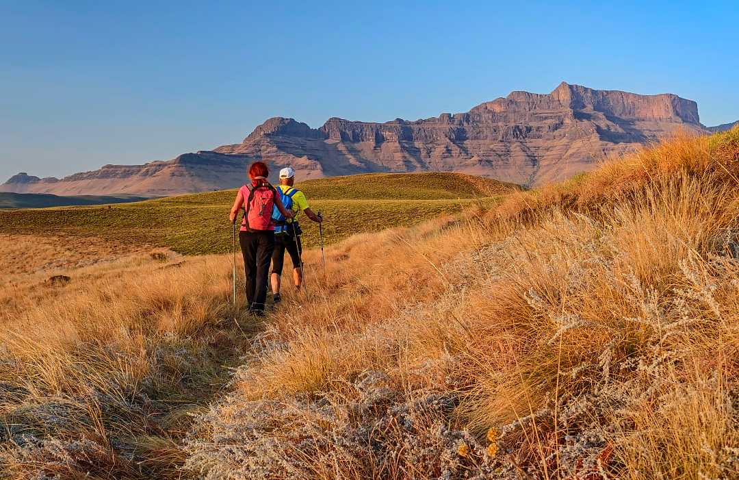The Drakensberg in KwaZulu-Natal, South Africa Senior couple hiking at The Drakensberg in KwaZulu-Natal, South Africa